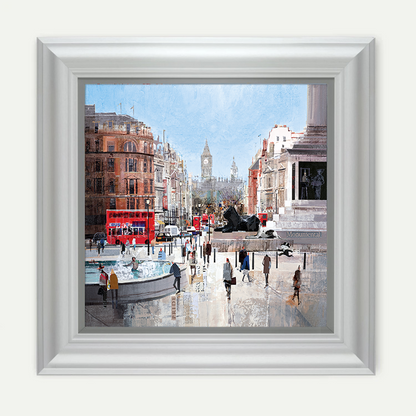 Framed artwork of a city street scene with a red double-decker bus and people walking.